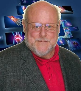 A person in a suit and glasses