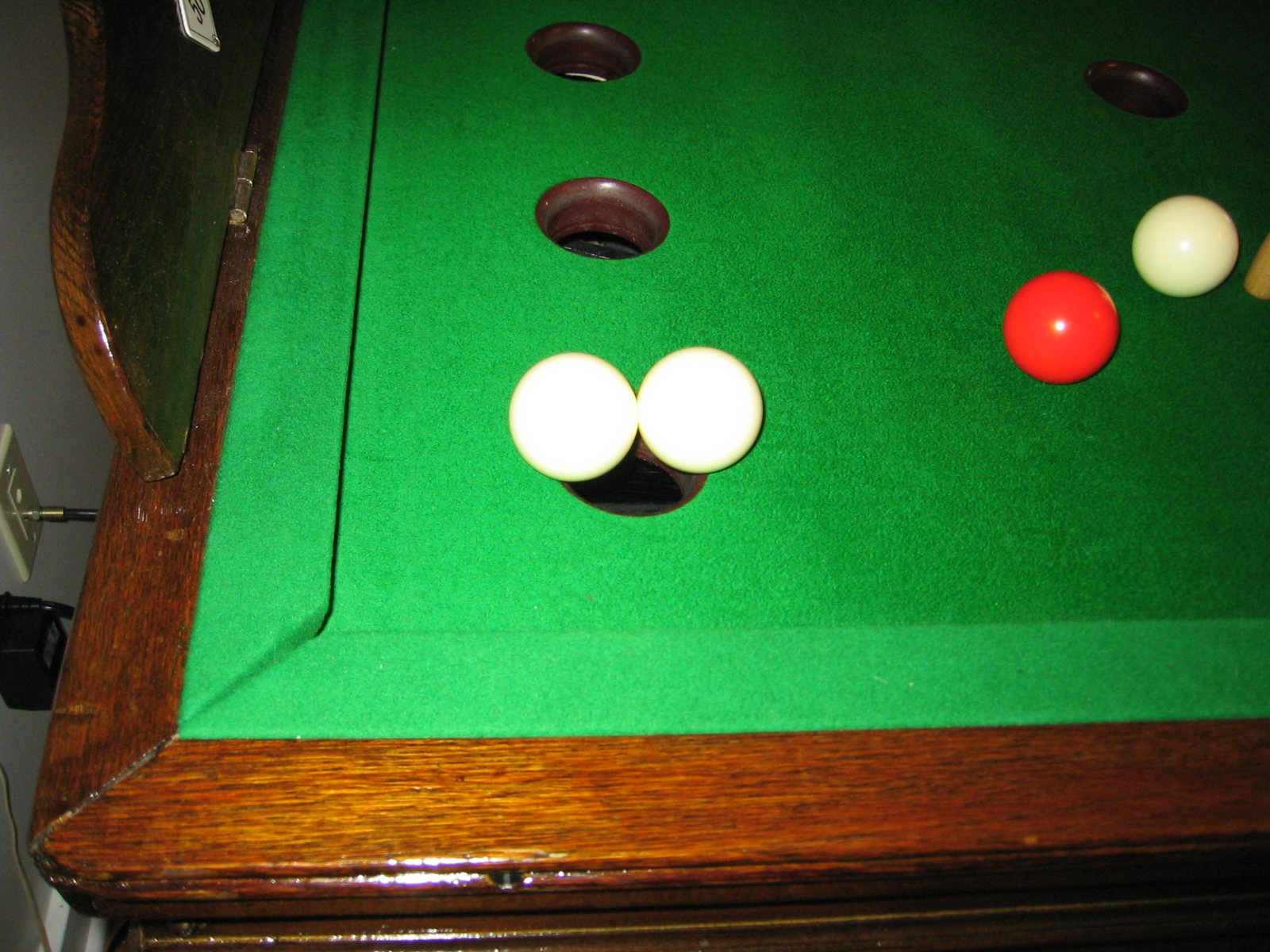 two balls over one hole